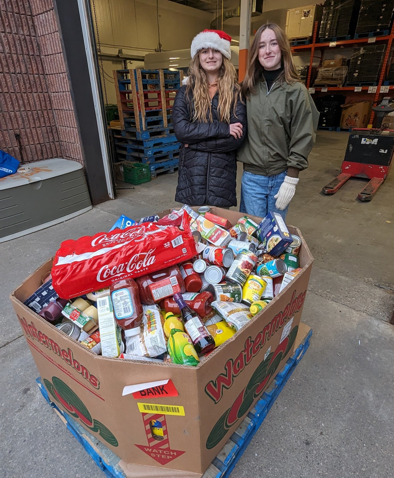 Picture of Morgan and Claire's donation at the Food Bank of Waterloo Region